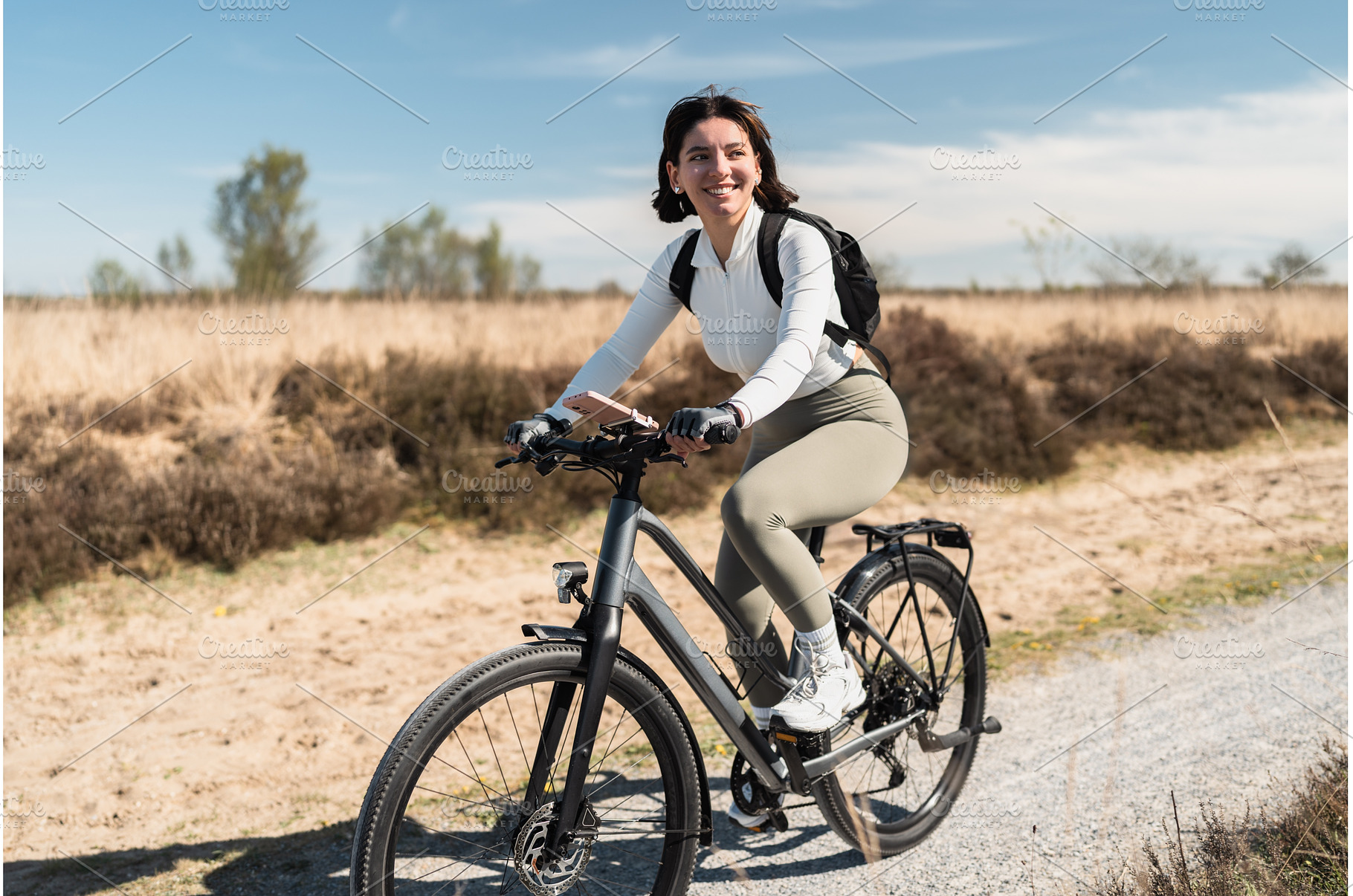 Breezy journey as a smiling woman in, a Sports & Recreation Photo by AD Stock Images