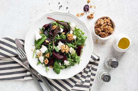 Healthy salad with beetroot, feta, a Food & Drink Photo by The baking man