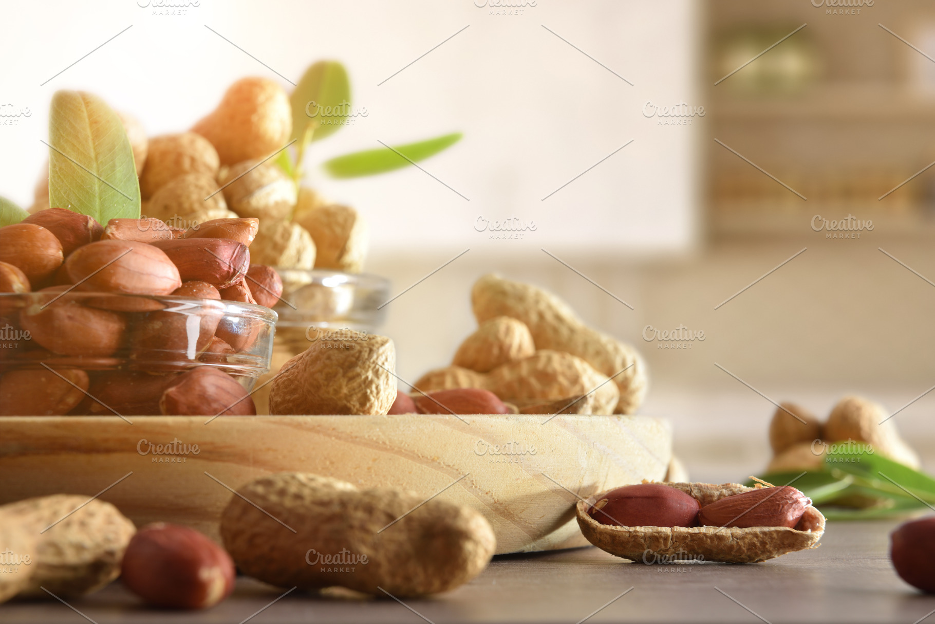 Peanuts in glass bowls on wooden bench in kitchen, a Food & Drink Photo by Davizro's Market