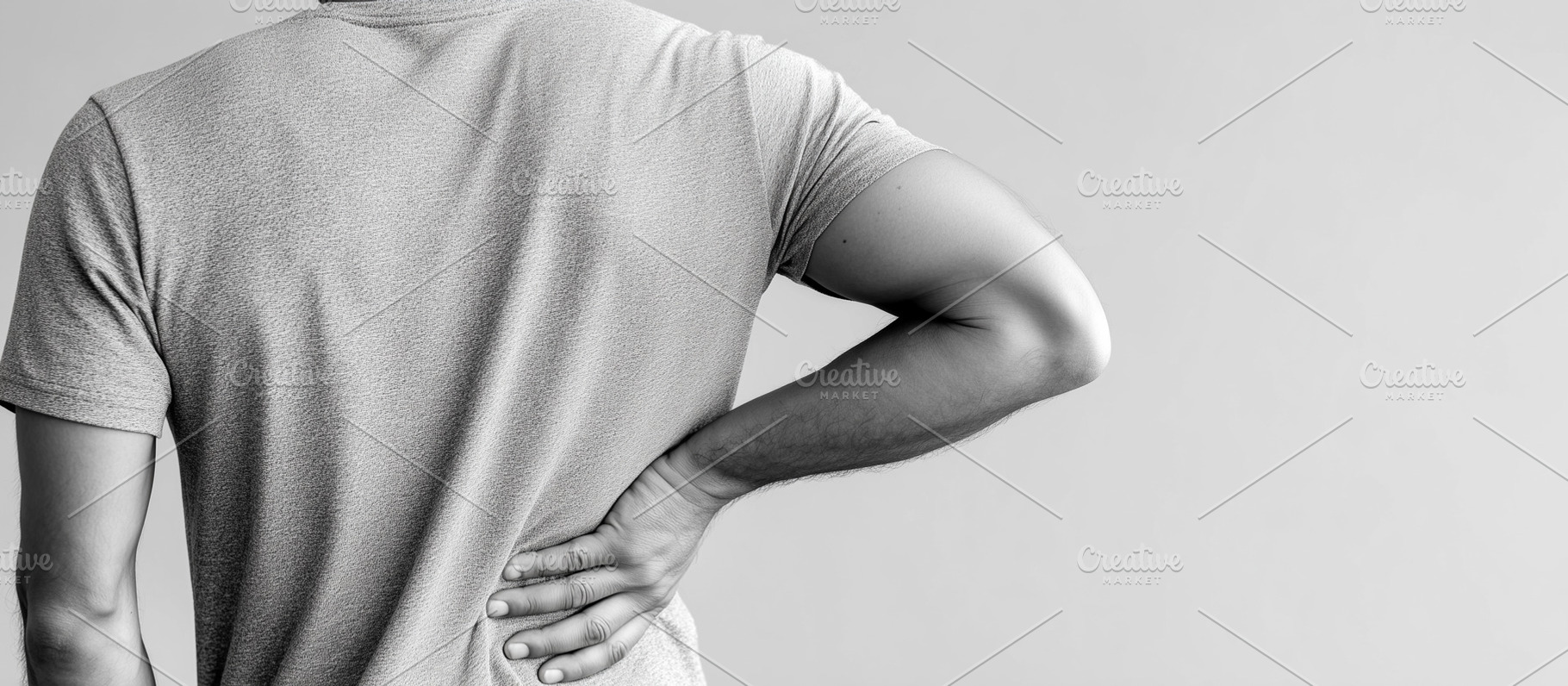 Man holding their lower back in pain, a Health & Medical Photo by MistyDay