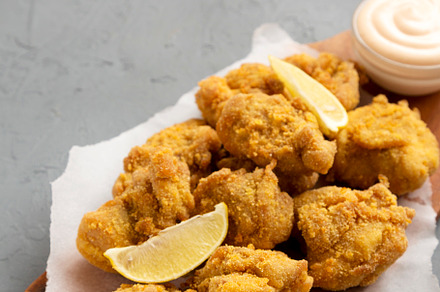 Homemade traditional japanese fried chicken Karaage on a rustic, a Food & Drink Photo by LiudmylaChuhunova