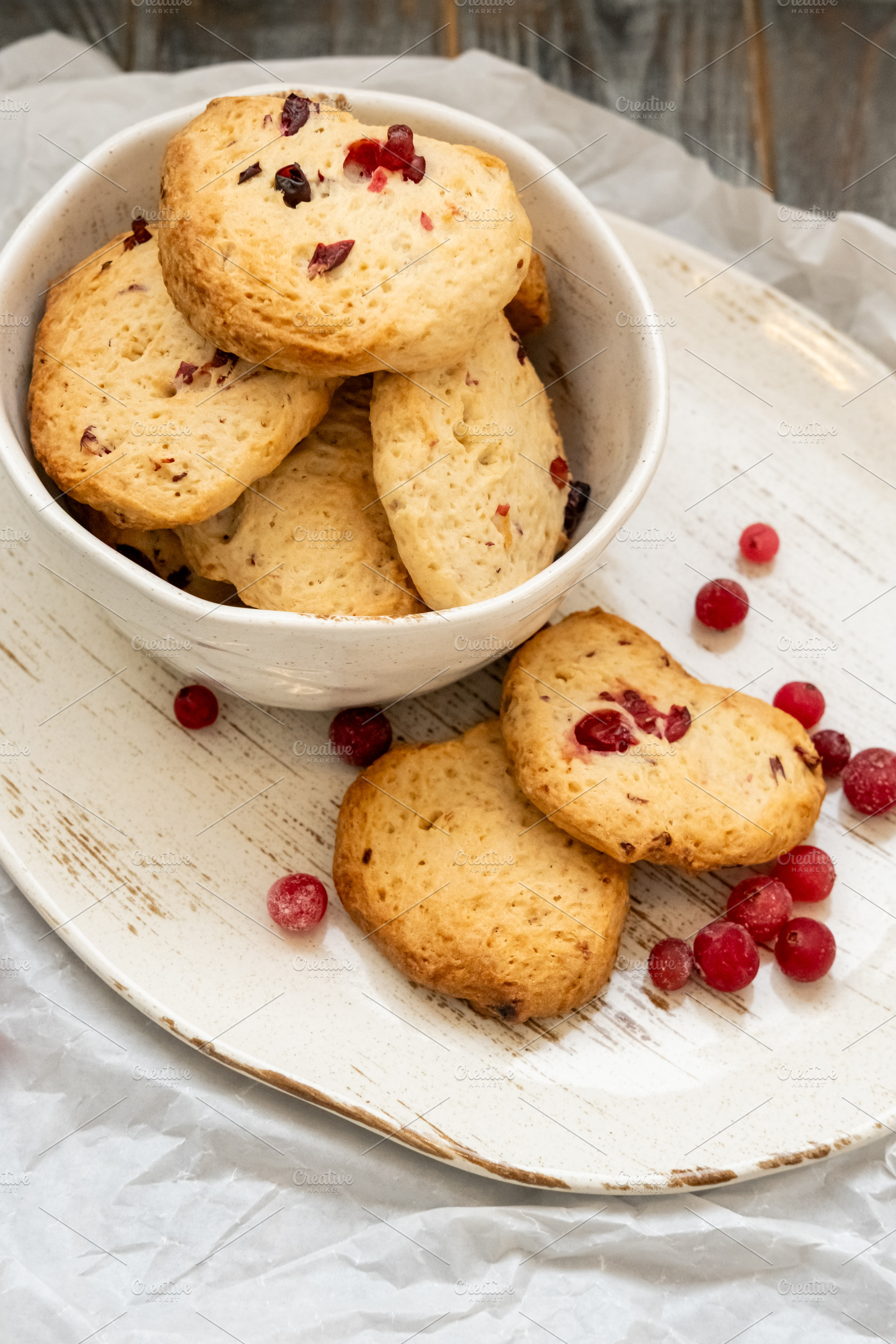 Homemade biscuits baked treats plate red berries, a Food & Drink Photo by Photo Drive Studio