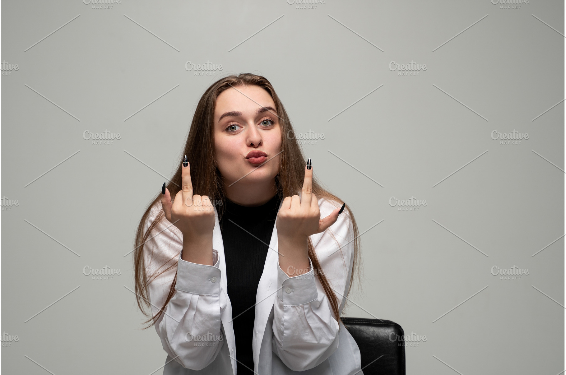 Woman showing rude middle finger, a Person Photo by volodymyrshtun13795