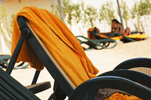 Beach bed with towel lying on it