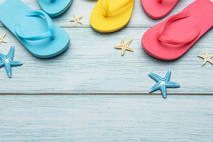 Colorful flip flops and starfish creating summer vacation atmosp, a Holiday Photo by Olena Rudo