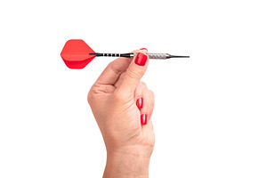 Close-up of a female hand with red nails holding a red dart, iso, a Sports & Recreation Photo by Ales Munt