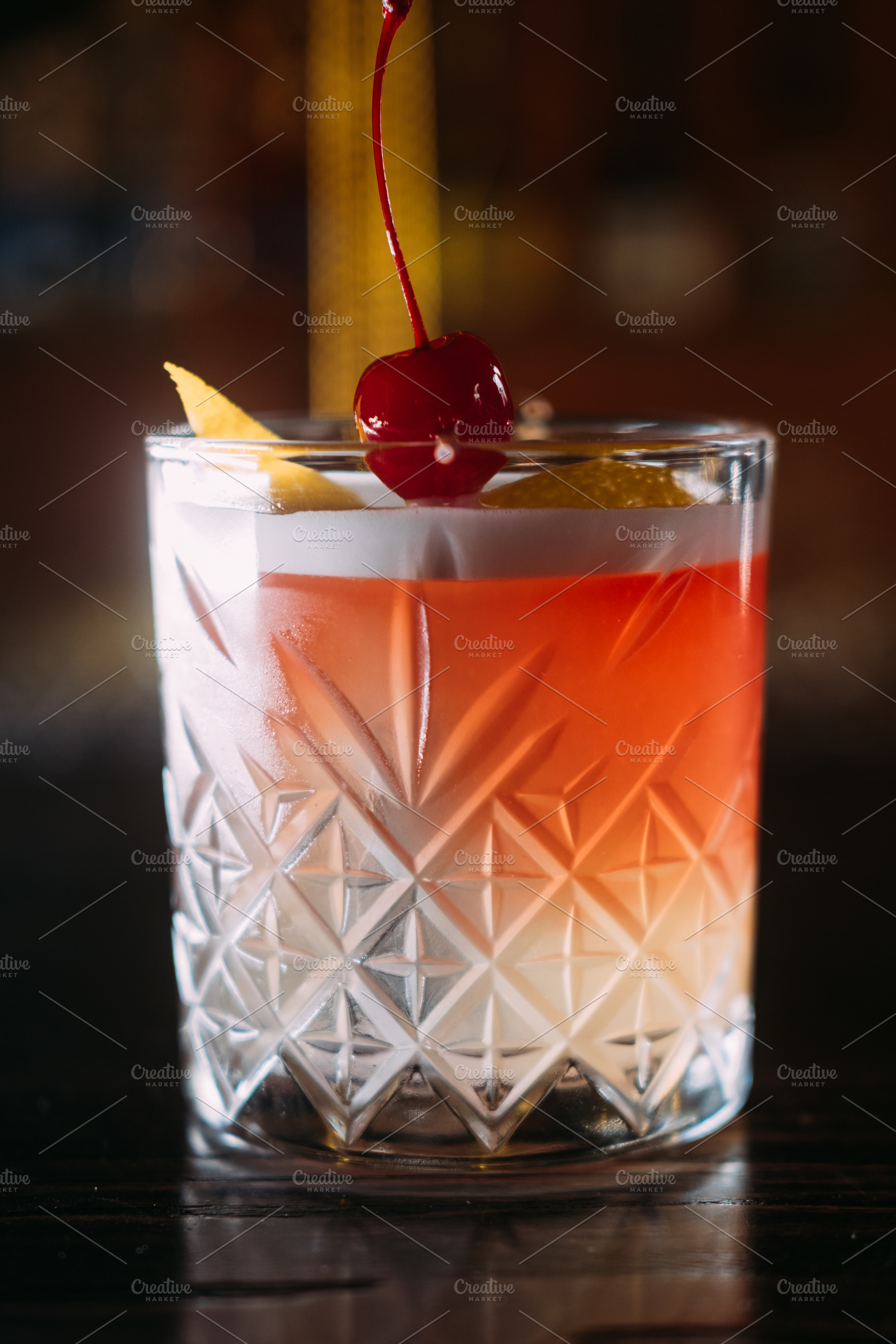 Cocktail drink tropical beverage glass zest cherry, a Food & Drink Photo by Photo Drive Studio