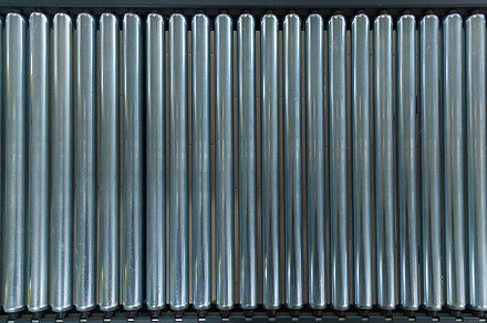 Crossing of the roller conveyor containing background, business, and food, an Industrial Photo by Photostock