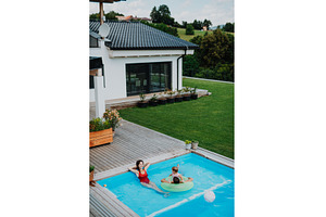 Happy family enjoying summer at pool, a Person Photo by HalfPoint