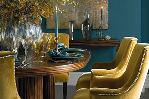Elegant dining room setting featuring a wooden table, velvet cha, a Photo by Studio ANNA