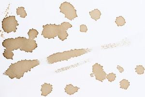 Various prints, blots and stains from spilled black coffee on wh, a Background Photo by ndanko