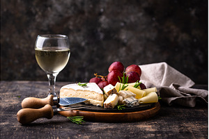 Different types of cheese, wine and, a Food & Drink Photo by Yulia Furman