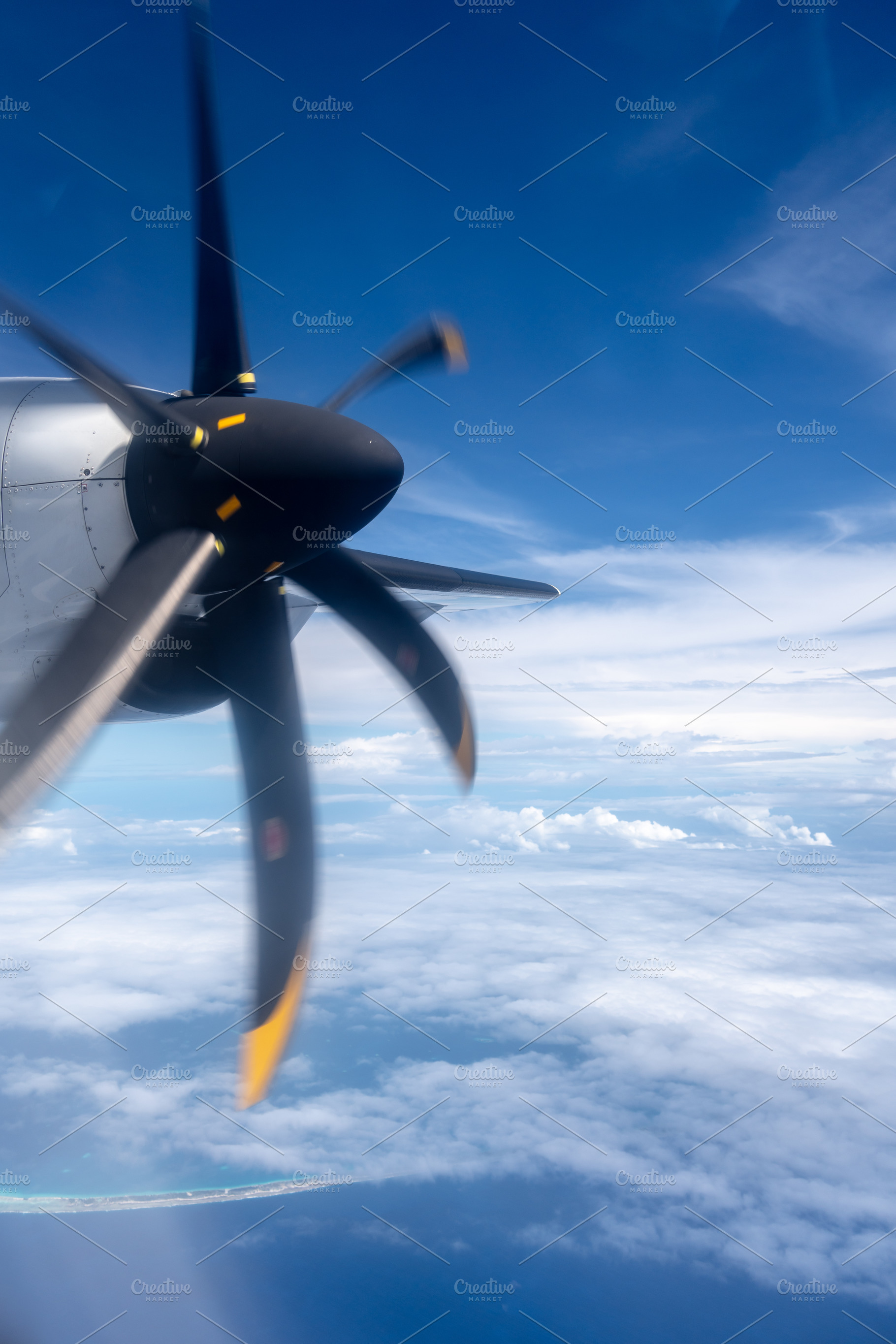 Aerial view of the Pacific Ocean with a spinning propeller, a Nature Photo by GoodGoods