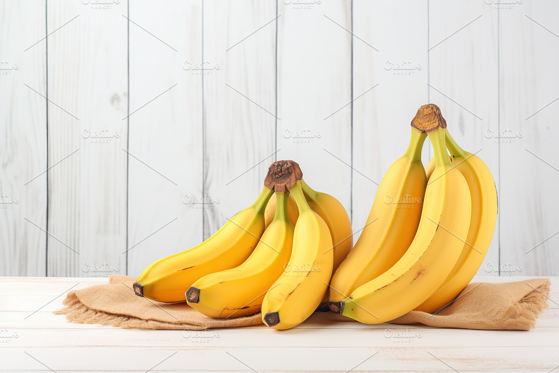 Ripe bananas on white wooden background, a Photo by AlyaAnd