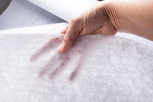 Hand Holding White Geotextile Fabric, an Industrial Photo by MDBildes