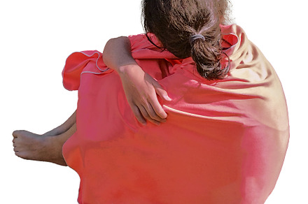 Teen woman wrapped in a blanket isolated photo
