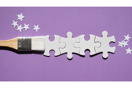 Paint brush with jigsaw puzzle paint, a Holiday Photo by tilialucida