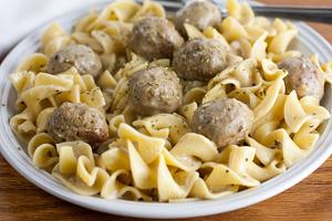 Meatball stroganoff containing beef, cream cheese, and food
