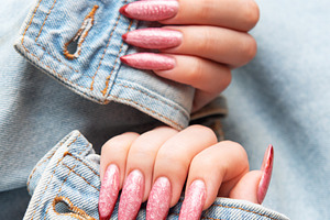 Woman showing trendy pink stiletto nails with denim jacket, a Beauty & Fashion Photo by Olena Rudo