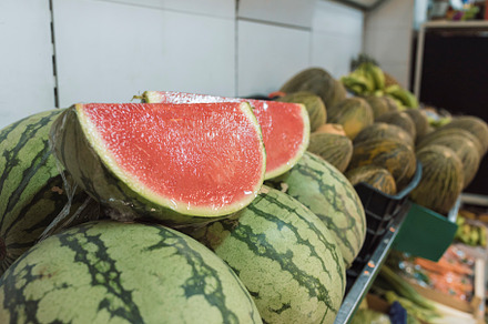 watermelons cut and placed for sale in the greengrocer's, a Food & Drink Photo by YossSabalet