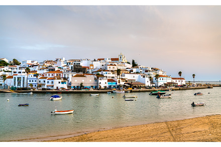 Ferragudo village at sunset. Algarve, an Architecture Photo by Leonid Andronov