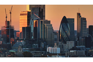 London skyline reflecting orange, an Architecture Photo by Goinyk