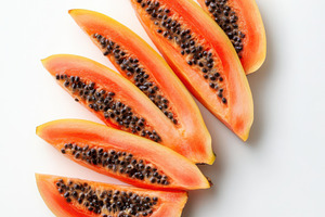Sliced fresh papaya fruits isolated, a Food & Drink Photo by Pixeness Studio
