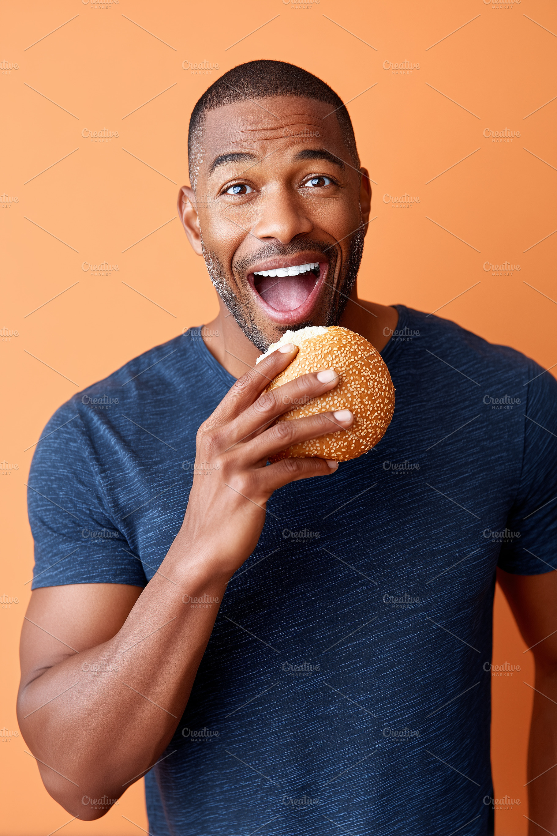 Happy black man in a blue shirt is, a Food & Drink Photo by MistyDay