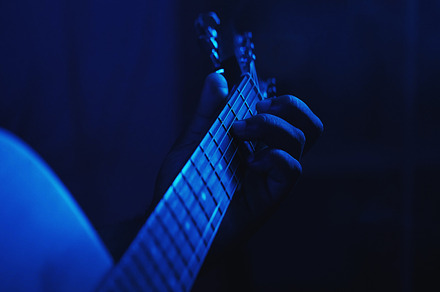 Live music man hands playing guitar blue light, a Person Photo by Photo Drive Studio