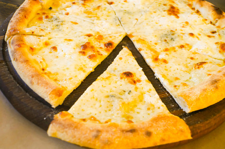 Slice of italian pizza with cheese, a Food & Drink Photo by Vapi
