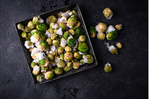Frozen Brussels sprouts on dark, a Food & Drink Photo by Yulia Furman