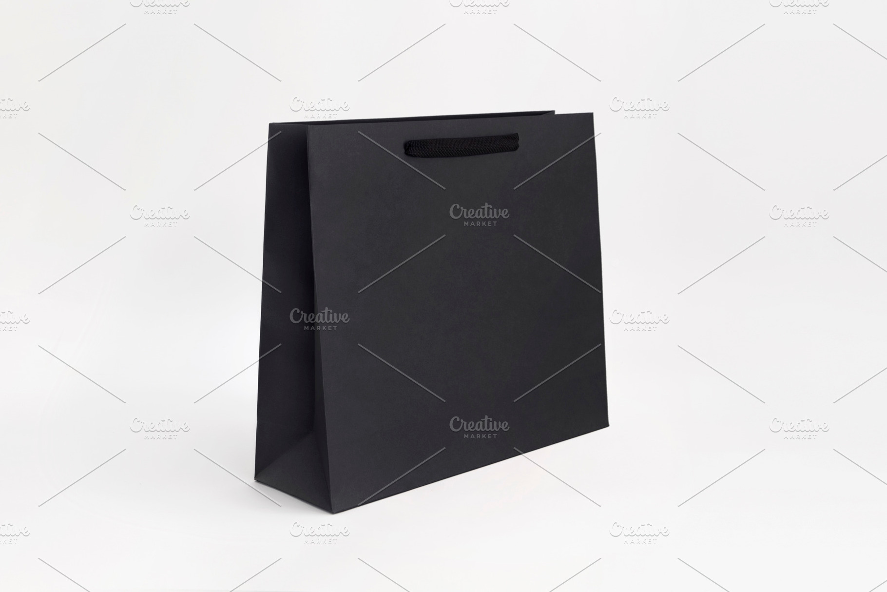 black luxury paper bag shopper, a Beauty & Fashion Photo by UN-BRANDED