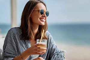 Cheerful woman in sunglasses enjoys, a Person Photo by MistyDay