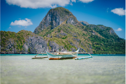 Boat on ocean water surface in El, a Nature Photo by Igor Tichonow