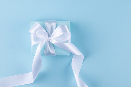 Christmas blue background. Holidays gift box wrapped in blue pap, a Holiday Photo by vimart