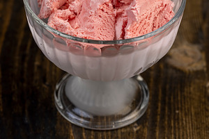 ice cream with berry flavor and smell, natural ice cream with added strawberry, a Photo by rsoollAI