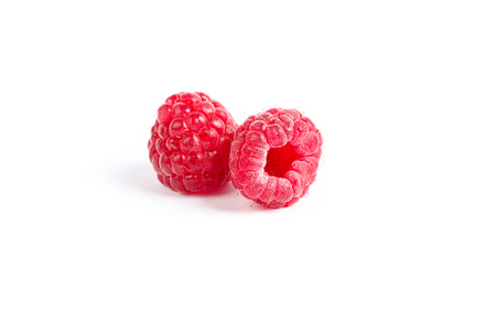 Fresh sweet raspberries isolated on white background, a Food & Drink Photo by AtlasStudio