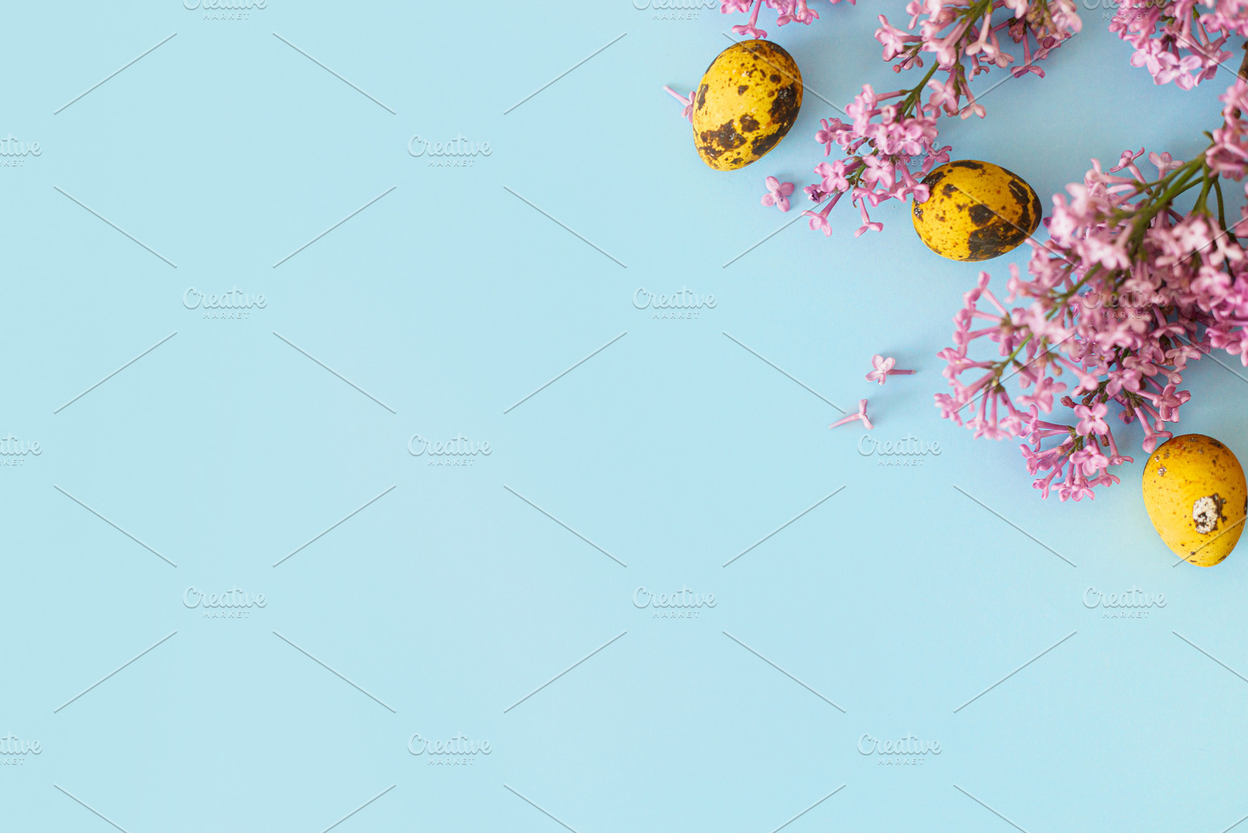 Happy Easter! Modern yellow eggs and lilac blossom flat lay with, a Holiday Photo by Sonjachni