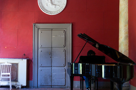 Boy girl playing piano indoors, Palazzo Venezia. Naples, a School & Education Photo by Bepslabor