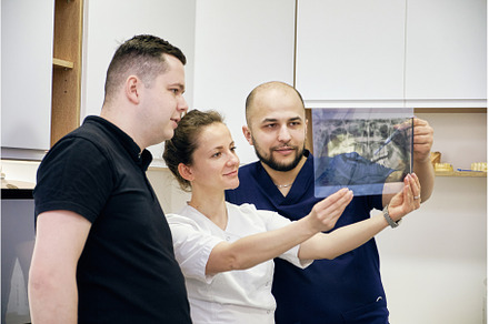 Dentists Analyzing a Dental X-Ray in