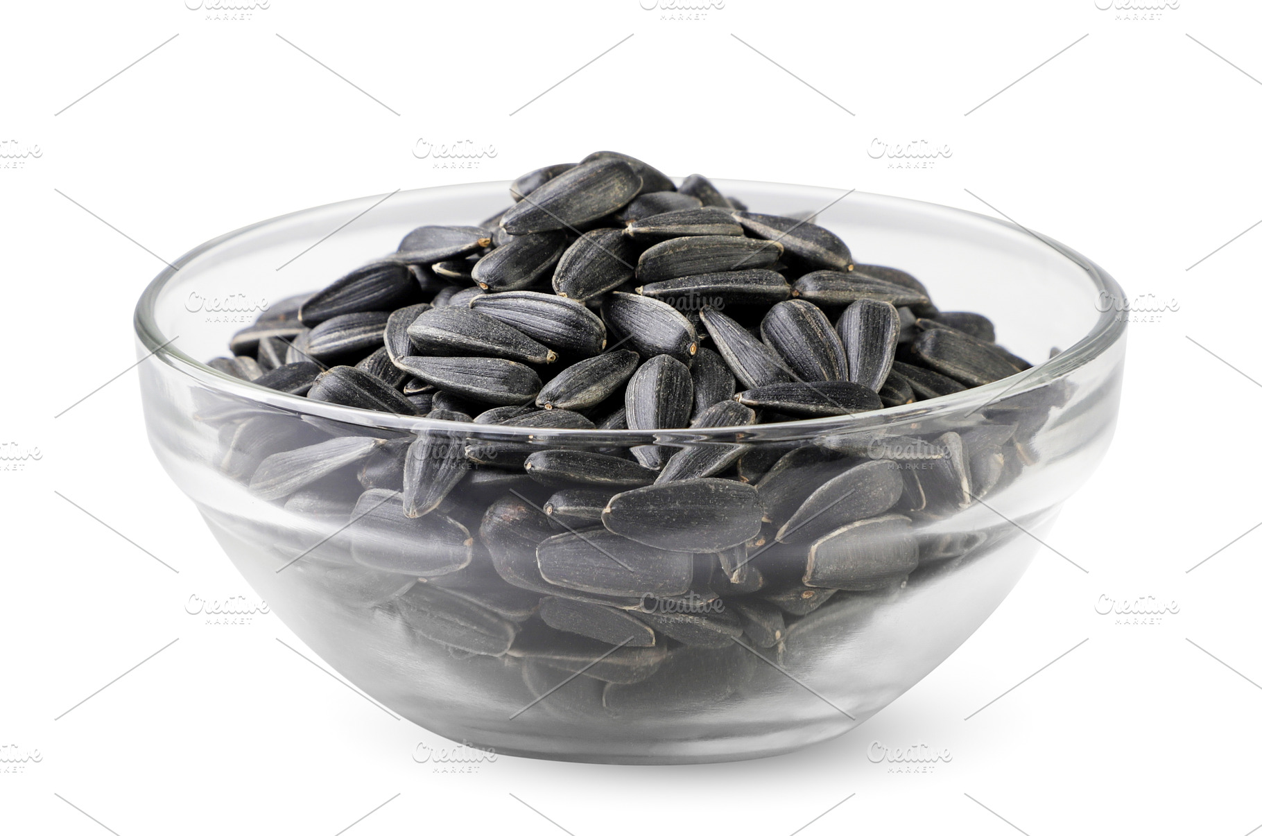 Sunflower seeds in a glass plate, a Food & Drink Photo by innakreativ