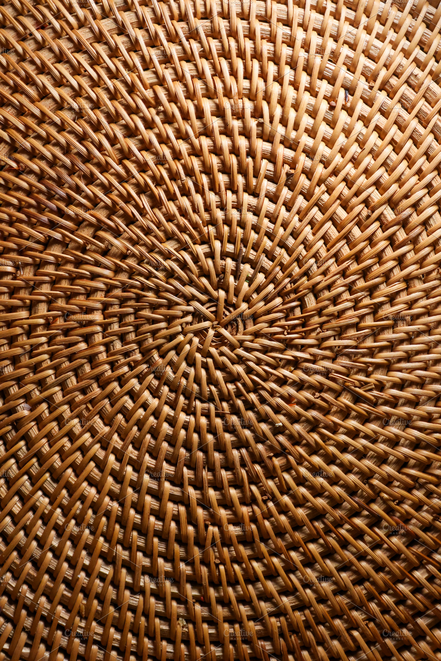 Wicker rattan craft showing intricate woven texture and natural, a Photo by Studio ANNA