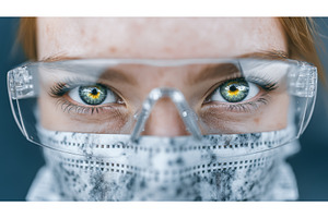 A female biologist is shown wearing, a Technology Photo by ZinetroN