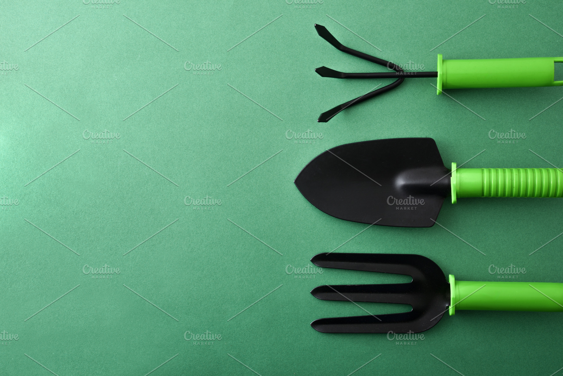 Minimalist Garden Tools on Green Background, a Nature Photo by Davizro's Market
