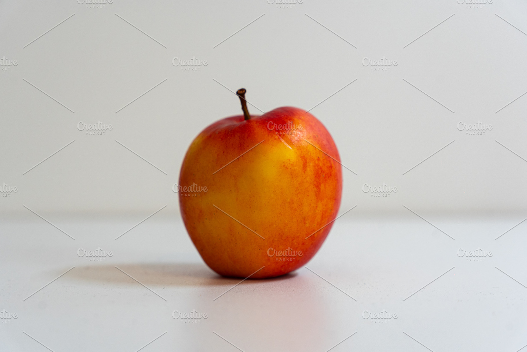 Apple isolated on white background, a Photo by OzkPhoto
