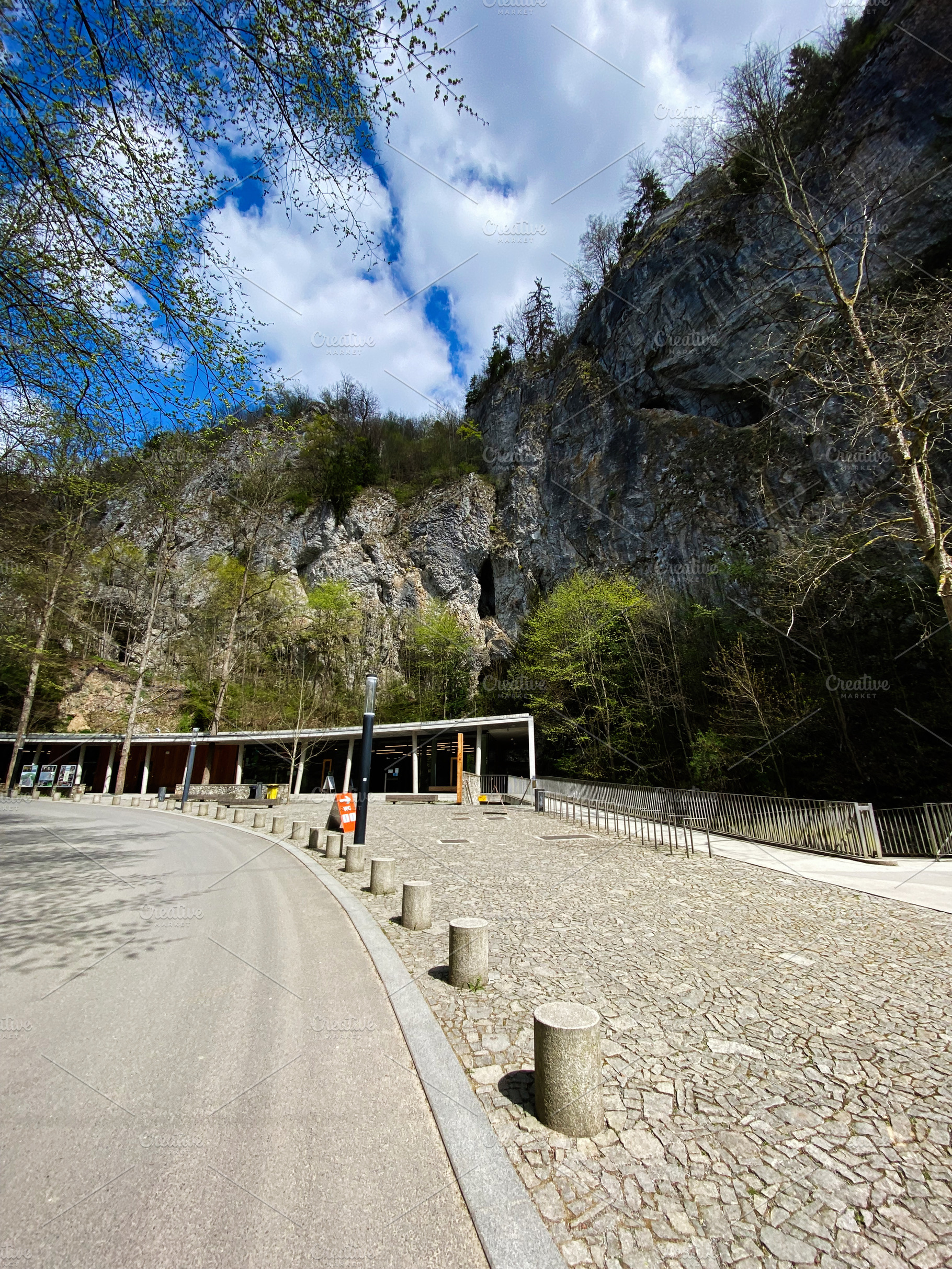 Scenic view of rocky landscape and pathway under a cloudy sky, a Photo by AS photostudio