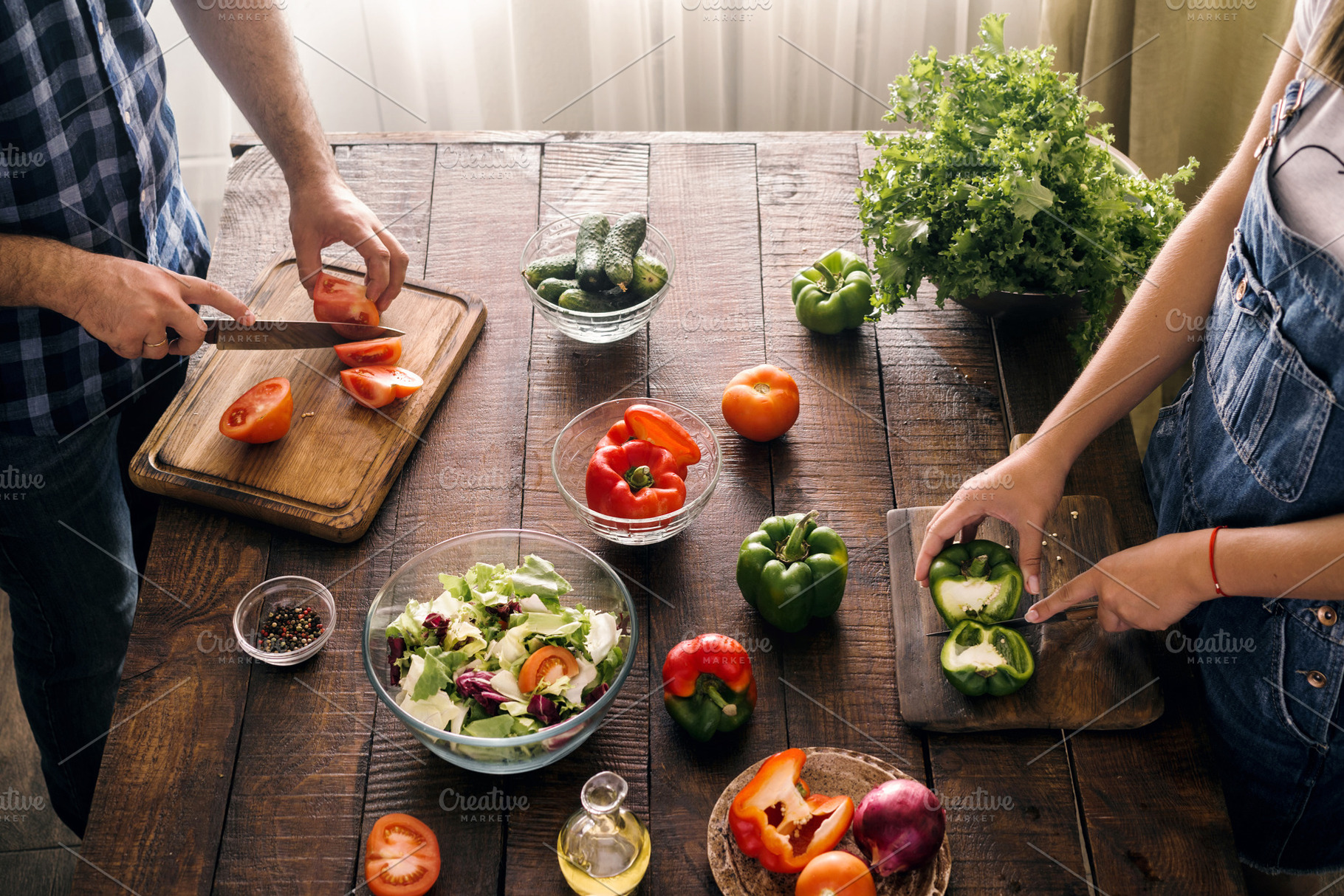 Married couple cooking, a Food & Drink Photo by KucherPhoto