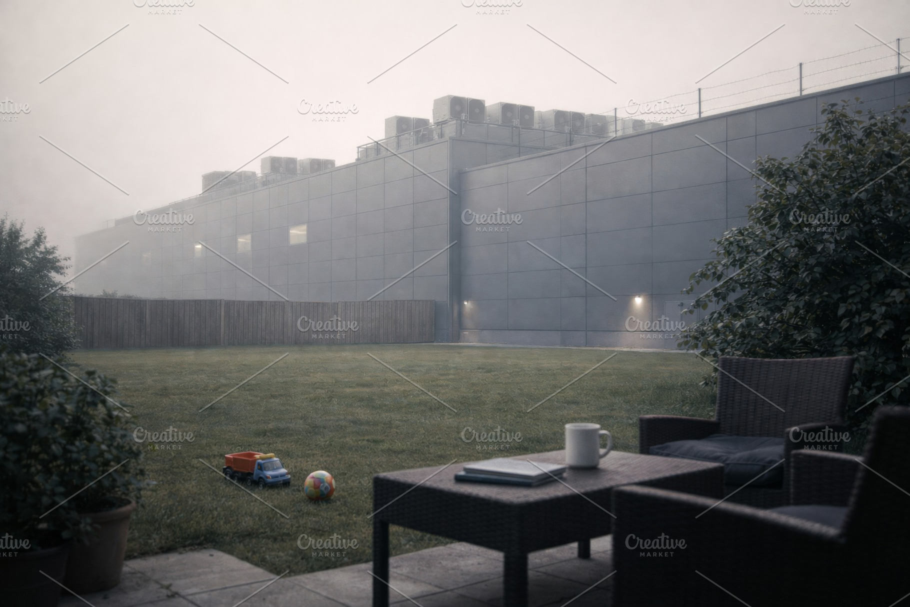 Data center exterior on foggy day with patio furniture and toys, a Photo by Dvoevnore photos