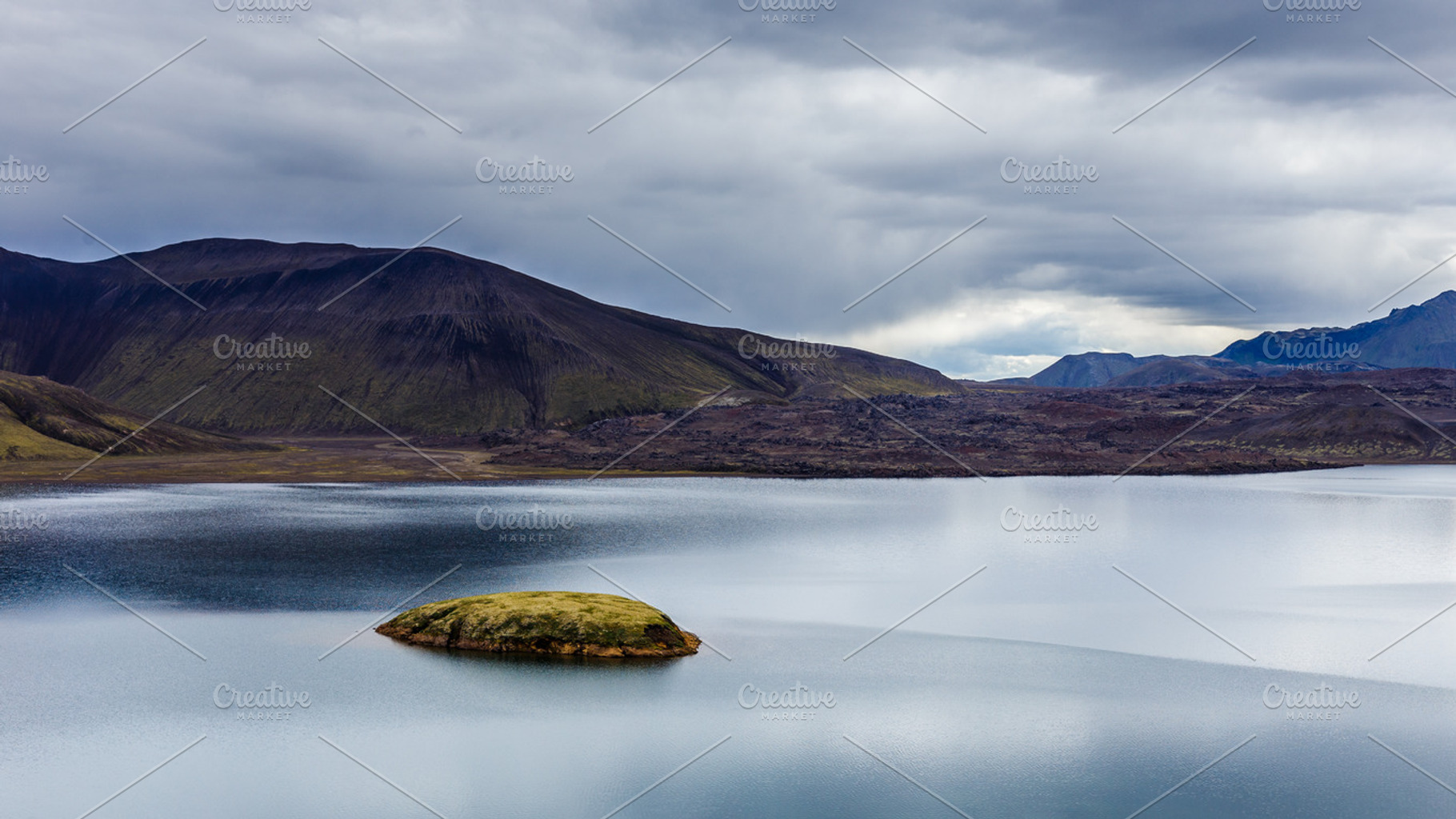 Lake with small island in Iceland, a Nature Photo by grycikua