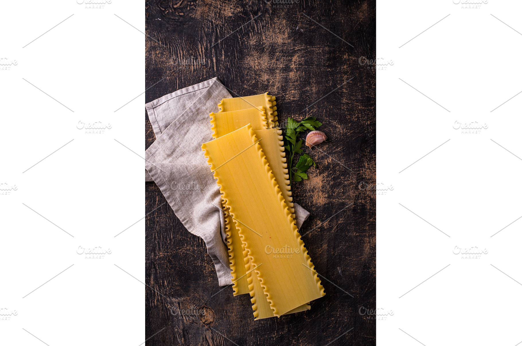 Uncooked lasagna pasta with cooking, a Food & Drink Photo by Yulia Furman